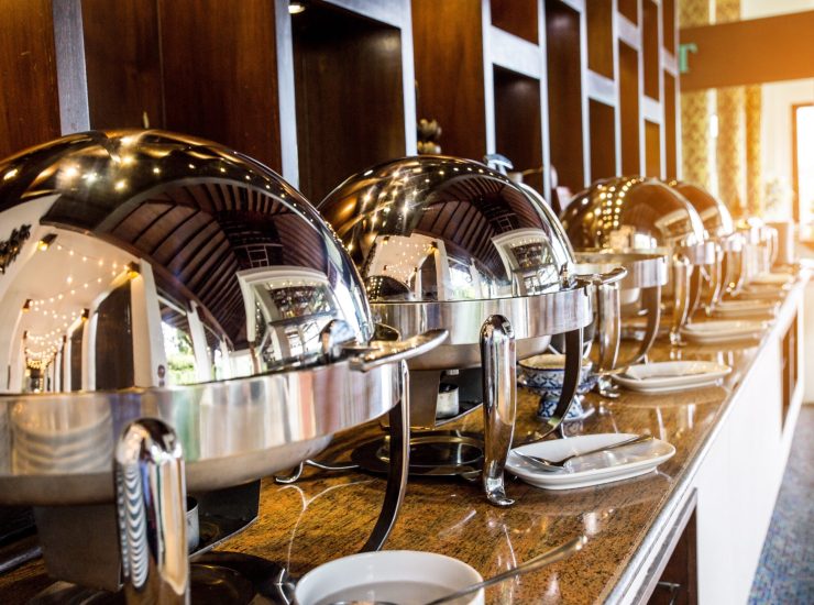 Catering buffet food with heated trays ready for service
