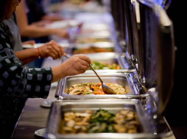 scooping the food, buffet food at restaurant, catering