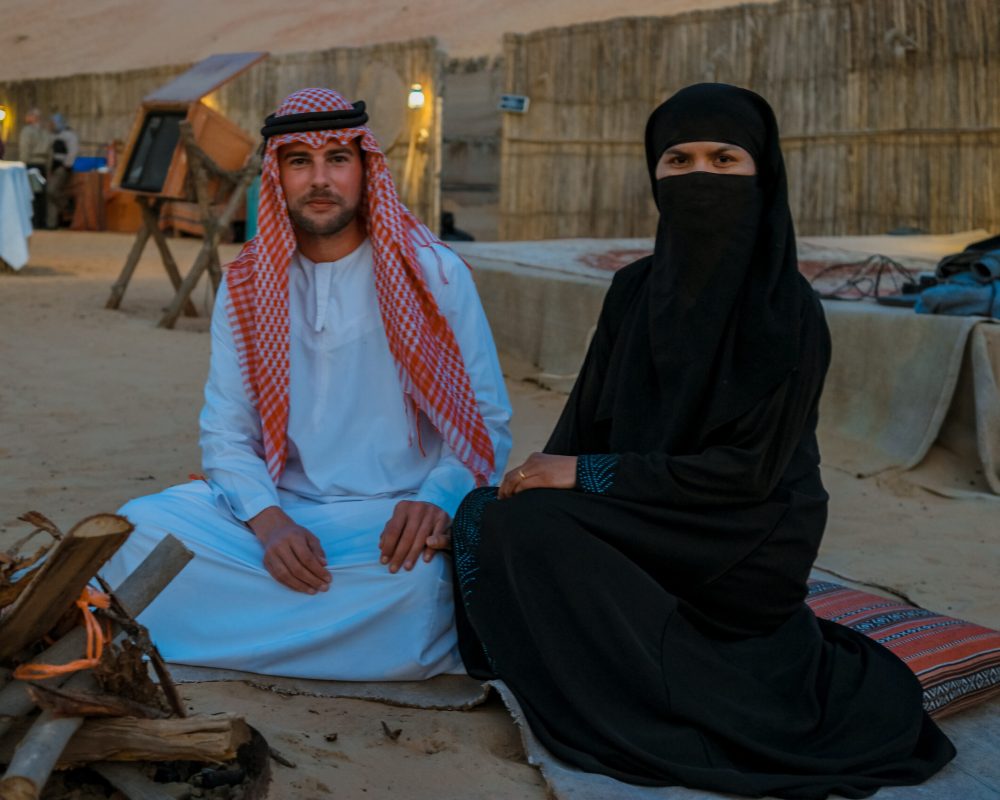 Couple Arabic clothes during Dubai desert safari at the safari camp, Dubai United Arab Emirates
